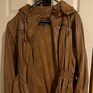 Faux leather coat with plush layer inside.